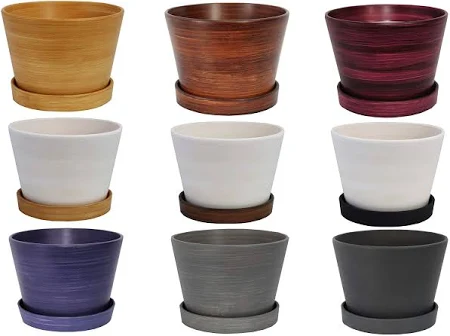 Nine colored ceramic planters with saucers in a grid